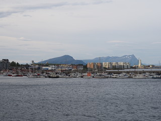 Landscape of waterfront and marina with yachts in european Bodo city at Salten region in Norway