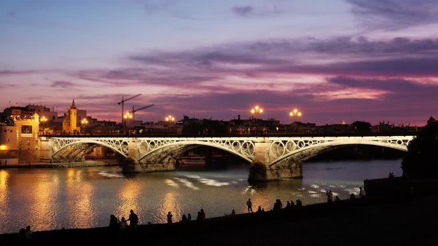 Triana Bridge In Seville Spain At Sunset