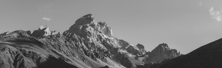 Fototapeta na wymiar Black and white shot of Panoramic view on Mount Ushba, Main Caucasian ridge. Zemo Svaneti, Georgia. Autumn landscape.