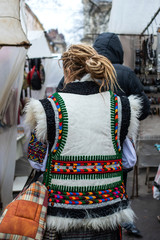 woman in Ukrainian dress walks through the streets of the city