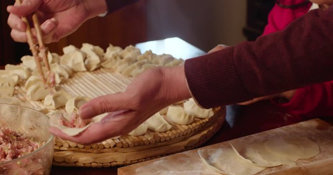 Happy family making dumplings at home,4K