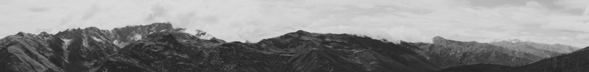 Black and white shot of Panoramic view of Svaneti range and latpari pass, Ushguli, Svaneti region of Georgia