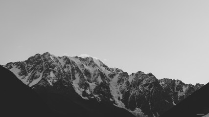 Black and white shot of Namkuani mountaine, morning view from Community Ushguli, Svanetia, Georgia, Main Caucasian Ridge.