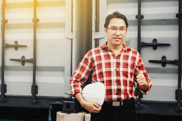 Obraz premium Engineer or worker or business man showing thump up hands symbol and white safety helmet.