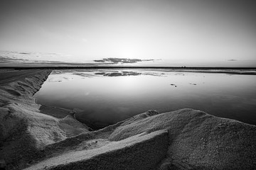 Nature reserve Saline Margherita di Savoia, Apulia, Italy: black and white image of  salt pan at...