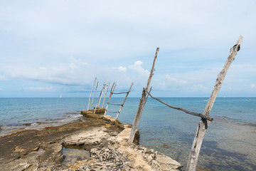 The old piers with the typical wooden cranes of Savudrija, a small fishing village in Croatia