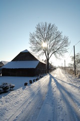 Old barn house road in winter