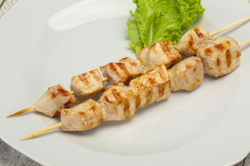 Grilled pork skewer served salad