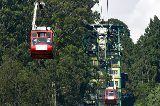 Big cabin of the cable car .The red cabin of the ropeway with tourists in the Indian city Gangtok