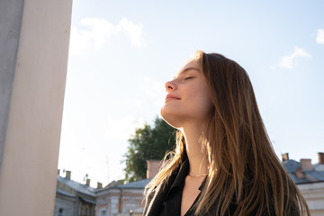 Sensual brunette girl with healthy skin bask in the sun