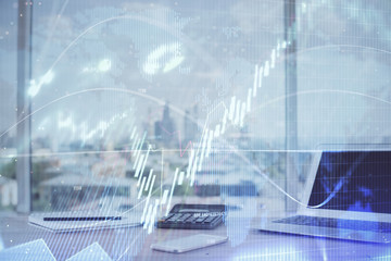 Forex Chart hologram on table with computer background. Multi exposure. Concept of financial markets.
