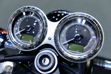 Speedometer on motorcycle dashboard background