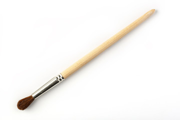 Brush with wooden handle on white background, isolated