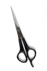 The closed scissors on a white background isolated