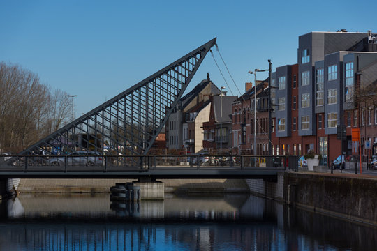 Dendermonde, Belgium - February 24: Vlasmarktbrug, a rocking triangle bridge over the Old Dender river