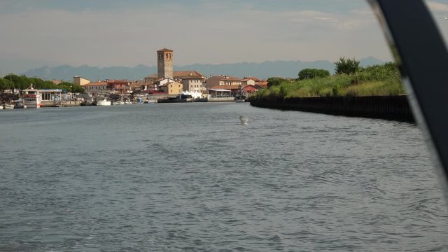 Marano Lagunare, a small town in northern Italy, seen from a canal.