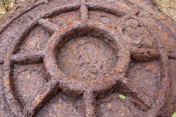 rusty hatch sewer,close up of big rusty hatch for sewer pit