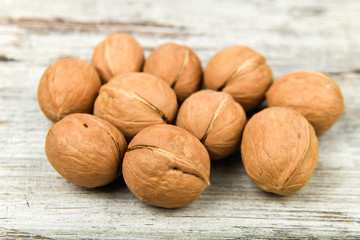 walnuts in the hands. Close up view of walnuts in her palm. Walnuts are 4 water, 15 protein, 65 fat and 14 carbohydrates, including 7 dietary fiber. In a reference portion of 100 grams.
