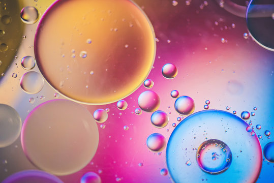 Oil drops in water. Abstract defocused psychedelic pattern image multicolored. Abstract background with colorful gradient colors. DOF