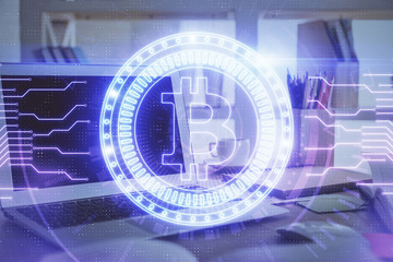 Multi exposure of blockchain theme hologram and table with computer background. Concept of bitcoin...