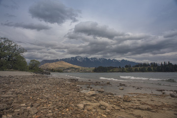 The Remarkables mountain view from Lake Wakatipu shore.