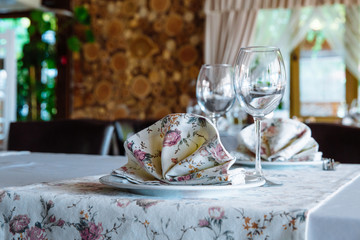 Table setting in restaurant.