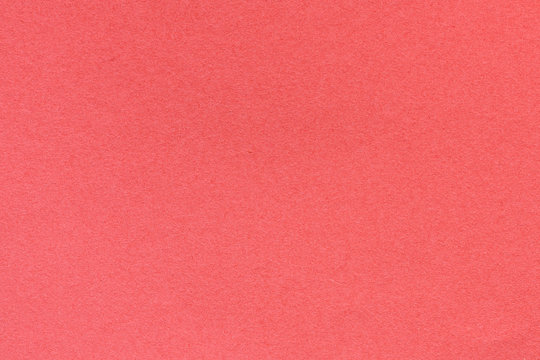 Red blank piece of paper. A high resolution photo of paper ideal as a background or texture.