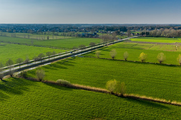 Green farmland in East Flanders, Belgium; aerial view