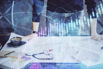 Multi exposure of man standing and planing investment with stock market forex chart.