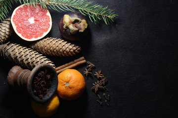 bowl with tobacco for hookah. fruits on a dark background. smoking hookah
