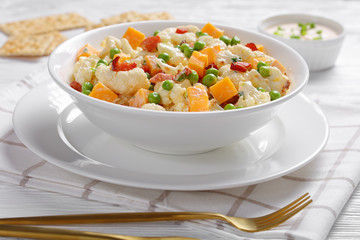 cauliflower salad with bacon, cheese, green peas