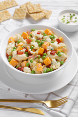 cauliflower salad in a white bowl, close-up
