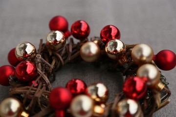 Red and gold balls in a wreath of branches for the New Year wreath