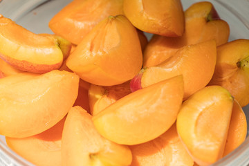 Fresh sliced apricot in a bowl.