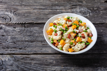 cauliflower salad in a white bowl, close-up