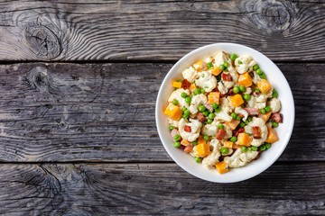 cauliflower salad with bacon, cheese, green peas