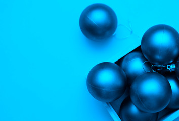 Blue christmas balls on background.