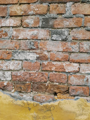 brick wall with beige plaster. texture, old red brick, 18th century masonry.