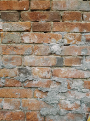 brick wall with beige plaster. texture, old red brick, 18th century masonry.