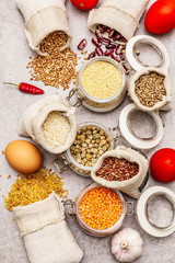 Zero waste food shopping concept. Cereals, pasta, legumes, dried mushrooms, spices. Sustainable lifestyle, old wooden boards background