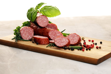 sausage slices, smoked meat product (tasty snack salami) menu concept. food background with cracow sausages