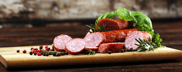 sausage slices, smoked meat product (tasty snack salami) menu concept. food background with cracow...