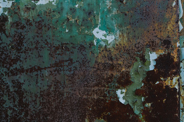 Old metal worn with blue paint and rust. Beautiful metallic background