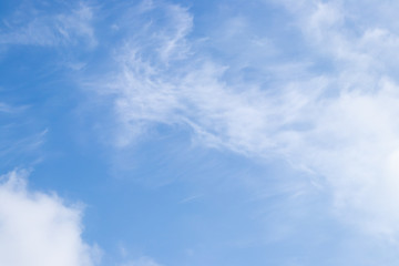 Clear blue sky with white cloud background