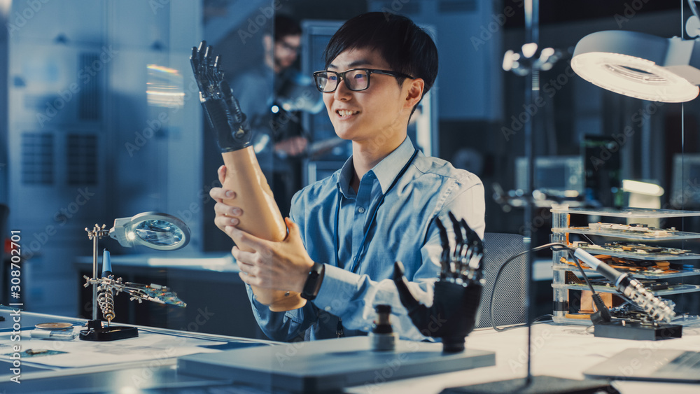 Poster futuristic prosthetic robot arm being tested by a professional japanese development engineer in a hi