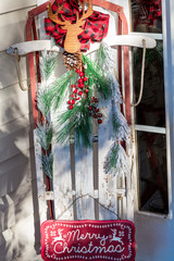 Decorated Sled with Greenery