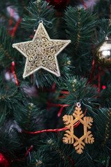 Beautiful Christmas tree with Christmas toys, star and garlands.