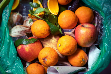 Food waste problem, leftovers Thrown into into the trash can. Spoiled food in refuse bin. Spoiled...