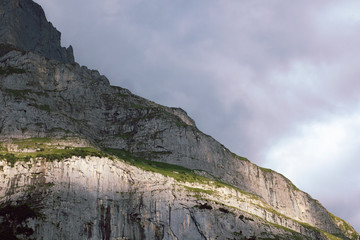 Rocky mountain detail with sunlight. Abstract mountain landscape. High mountain close up. Swiss alps.