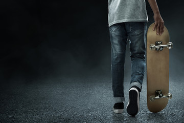 Man holding skateboard on the street © fotokitas